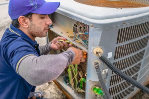 HVAC Tech working on AC